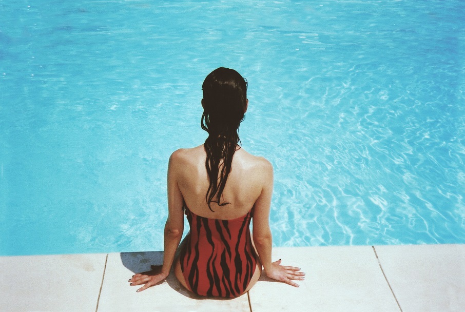 lady at edge of swimming pool