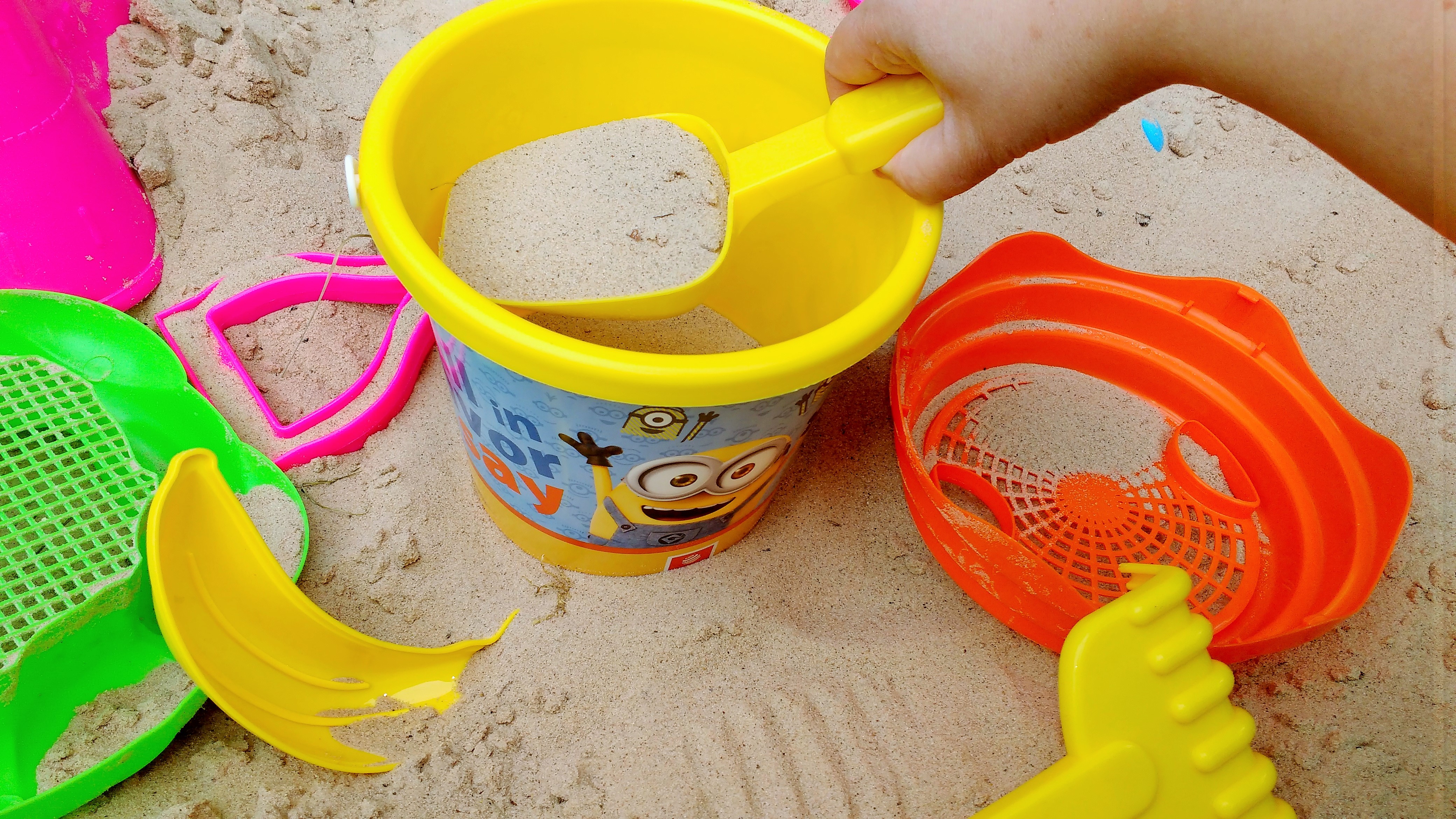 STEM activites for kids - child playing with bucket and spade