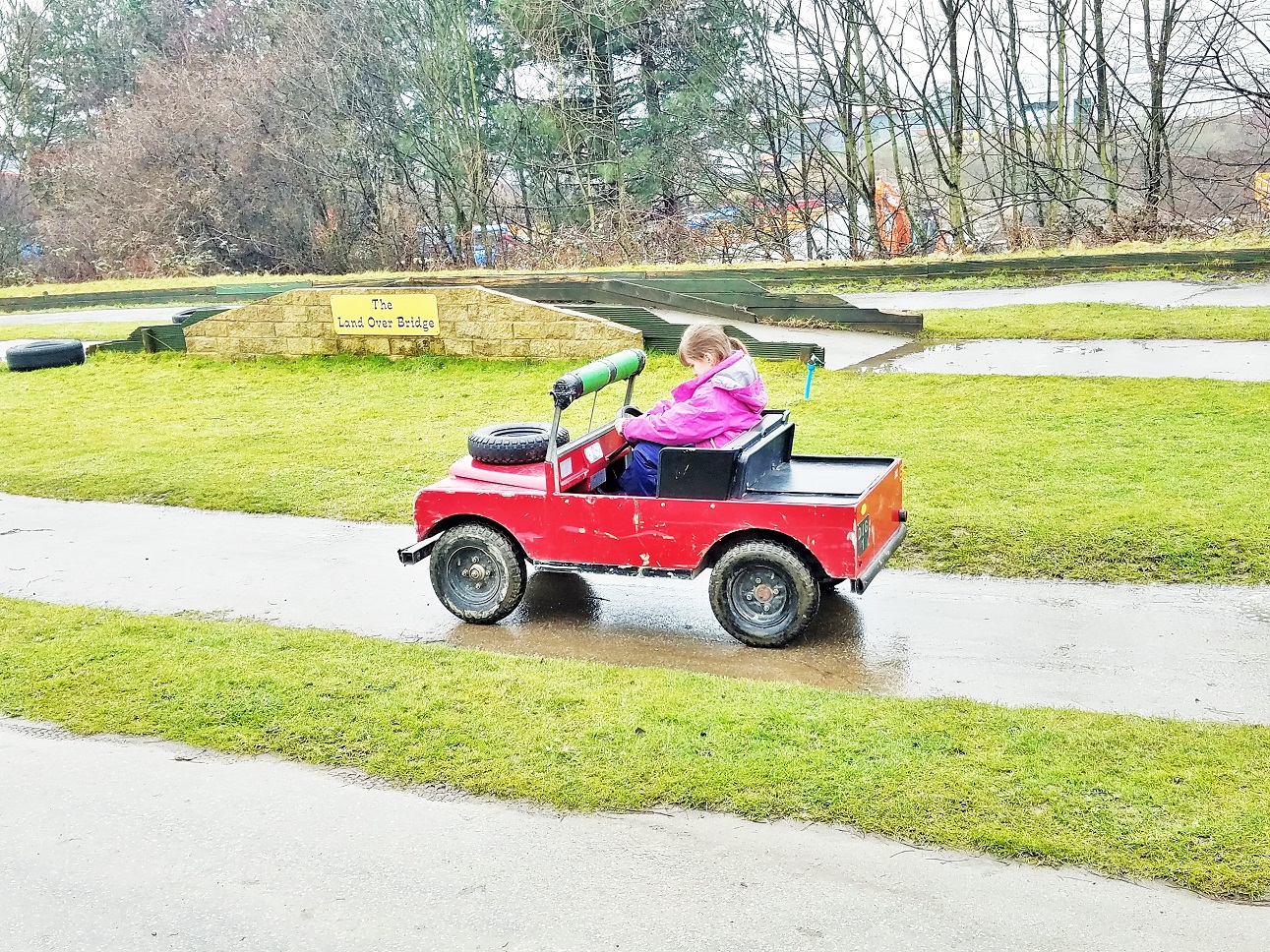 Diggerland in the rain - child driving a car