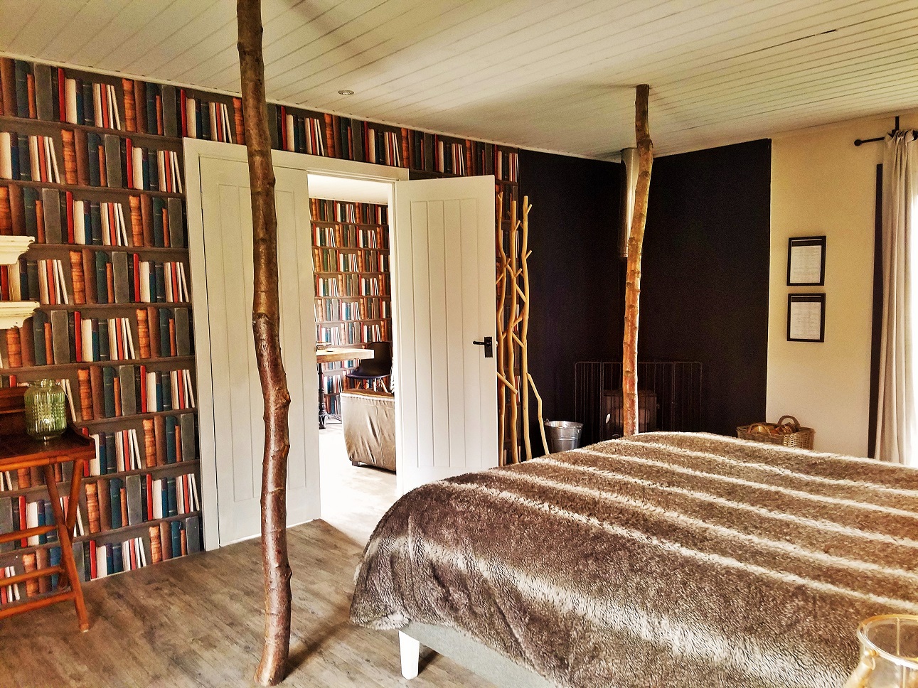 Master bedroom with four poster bed - glamping at North Star Club in East Yorkshire