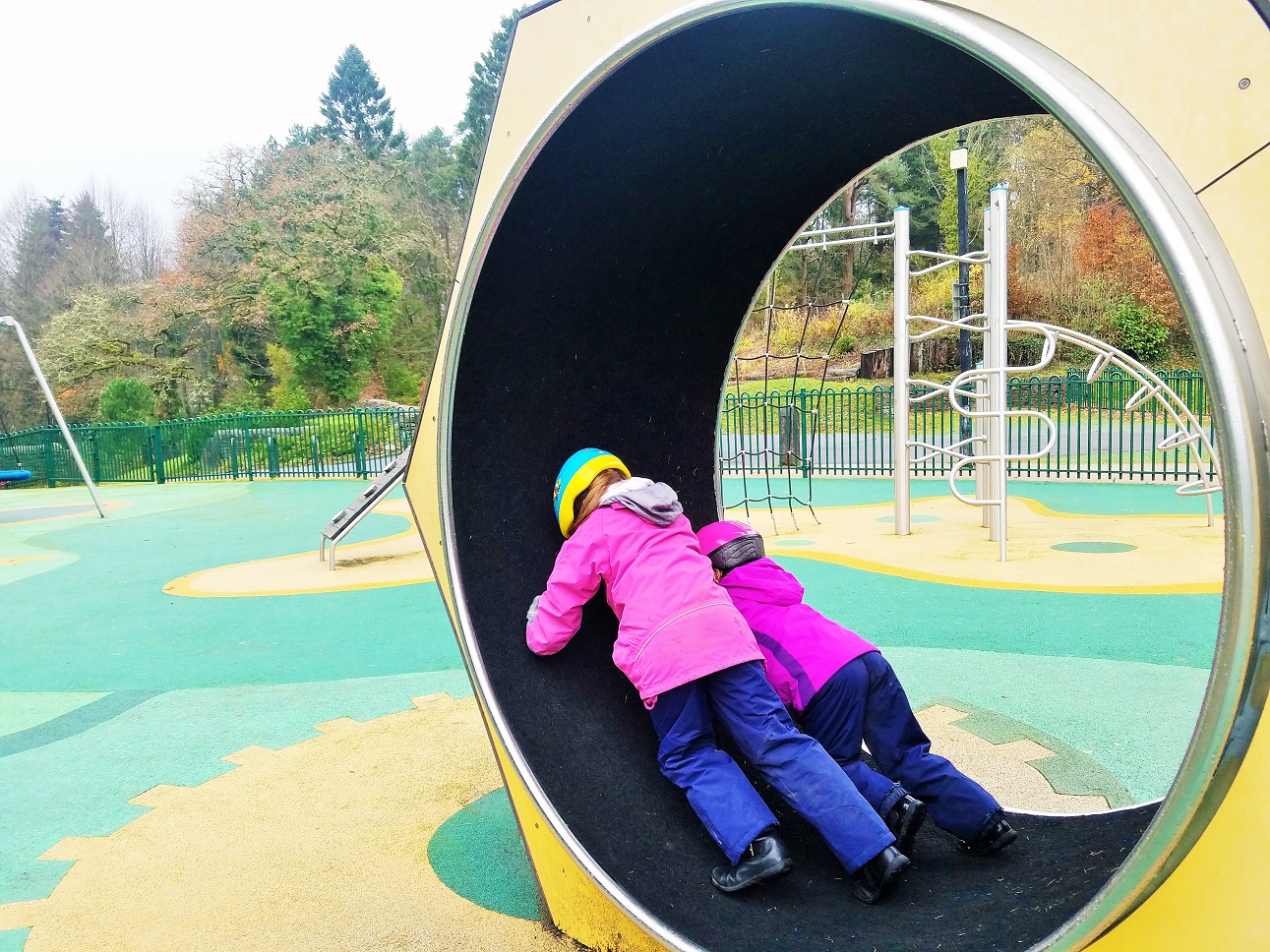 are attachment parenting and gentle parenting different - children on play park hamster wheel - BlogCrush Week 103